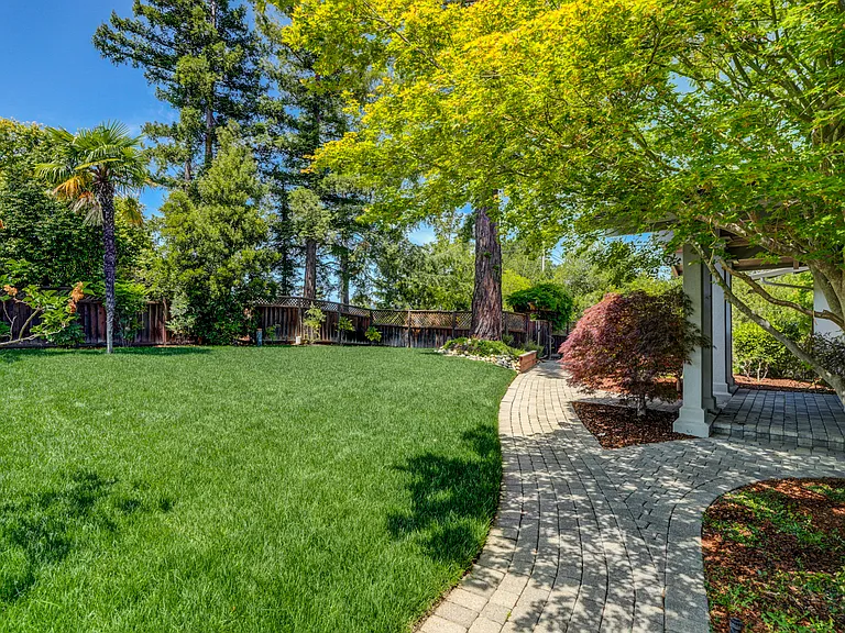 This tranquil home is located at the end of a cul-de-sac featuring a sparkling pool at the front and a wonderful rear upper deck beckoning for entertainment or relaxation, offering a spectacular view of the bay.