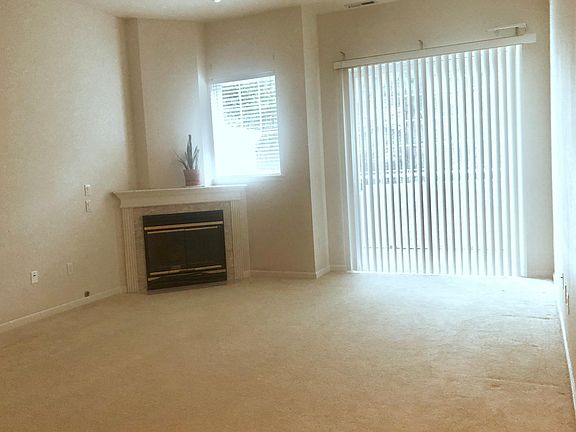 living room with gas fireplace in main floor