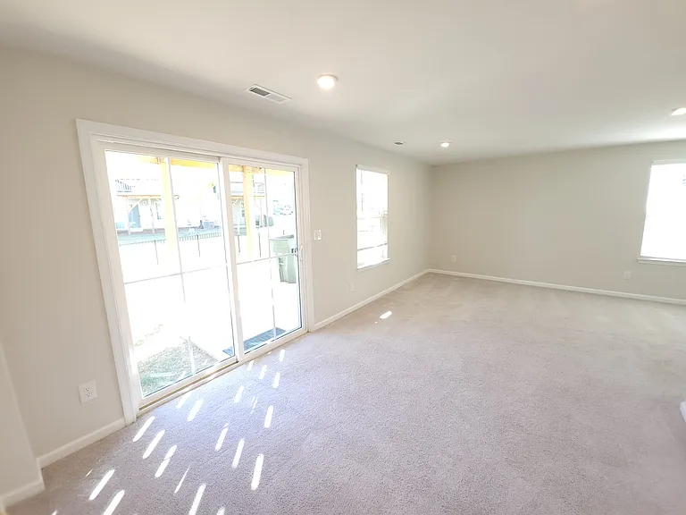 FIRST FLOOR FAMILY ROOM WITH GREAT NATURAL SUNLIGHT