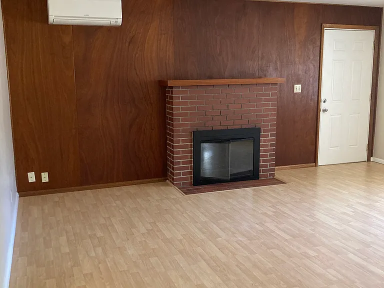 LIVINGROOM WITH DUCTLESS HEAT/AIR CONDITIONER.
