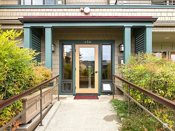 Enter the secure lobby to access your front door. There is an elevator from the garage and another back door in the second bedroom that leads outside to Red Pine Park and the waterfront trail.>
