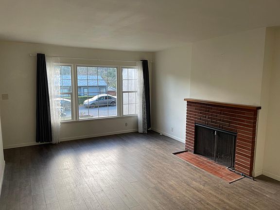 Large window in Livingroom with nice view of hill side