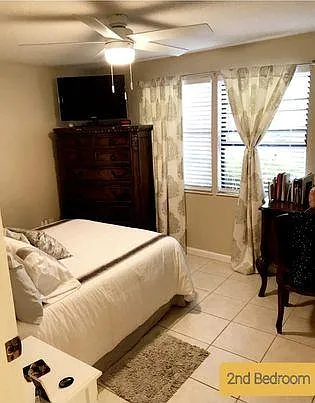Generous sized Second Bedroom. New Ceiling fan New faux blinds. Tiled floor.
