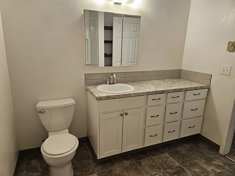 Full Bathroom (colors/vanity styles vary)