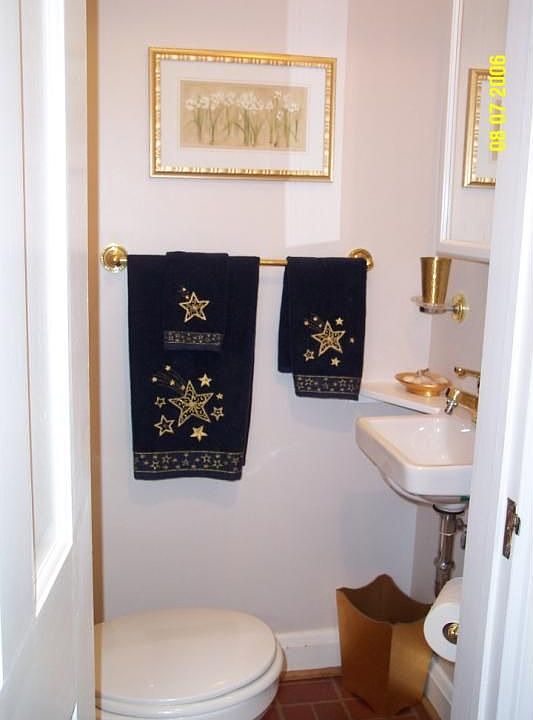 Powder room by front door.