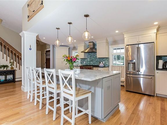 Kitchen view from dining area. Granite counter tops with Quartzite kitchen island.