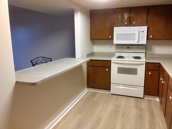 Like new appliances - microwave - self cleaning oven - wood lam flooring