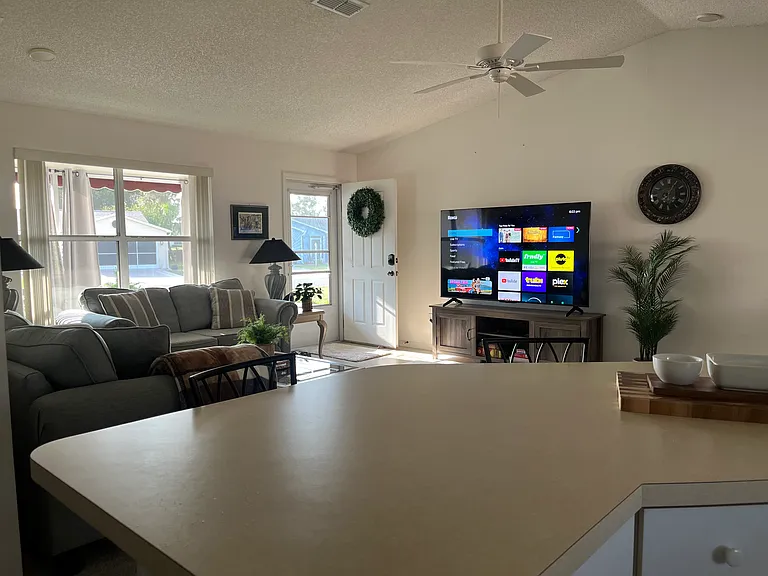 View from kitchen into living room. Open concept living