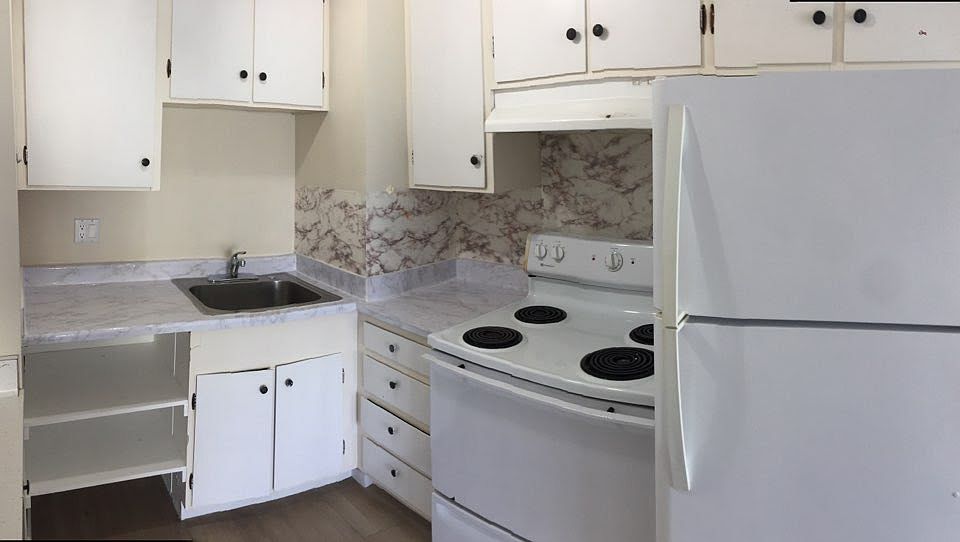 Kitchen with NO GARBAGE DISPOSAL and NO DISHWASHER. Refrigerator included, but not warranty by Landlord. Tenant is responsible to repair and/or replace refrigerator.