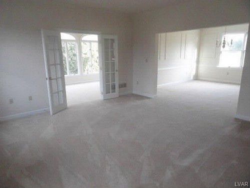 Living Room w/ French Doors to Sun Room