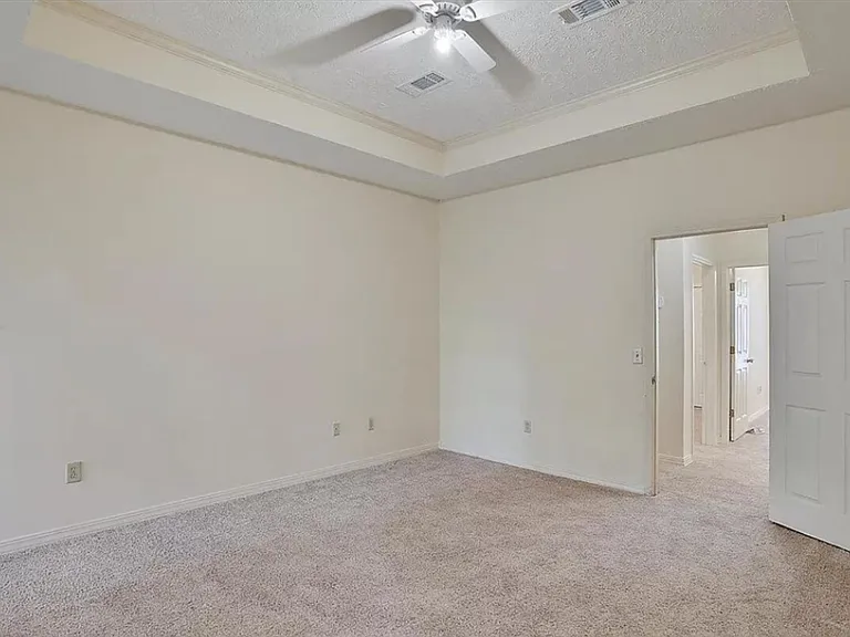 Master bedroom, view into master bathroom