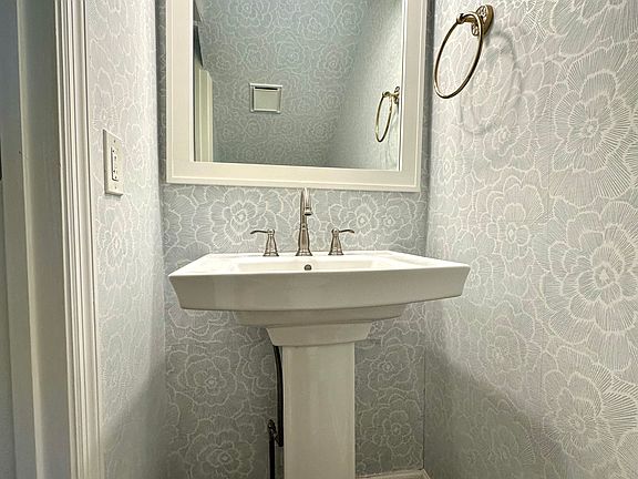 Downstairs hallway powder room with new wallpaper