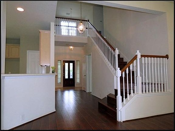 Two story entry with lead glass front door.