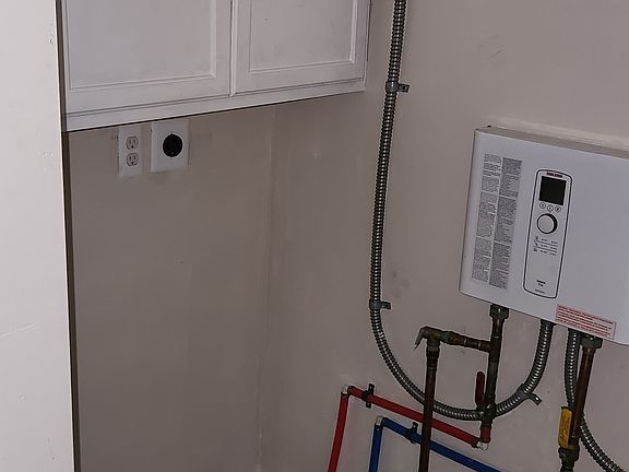 Tankless Water heater saves space, reduces risk of leaks and provides hot water on demand.