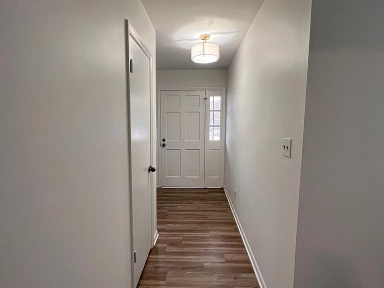Entryway exiting kitchen to main hall