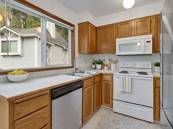 Well-appointed kitchen with stainless steel appliances, plenty of counter space, and classic cabinetry.