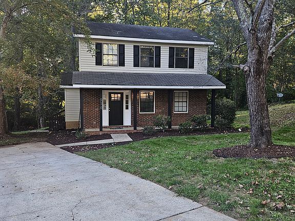 Front of house. Parking pad.