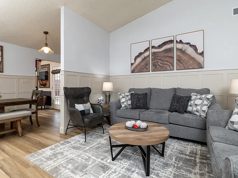 Spacious living room with extra pillows and blankets.