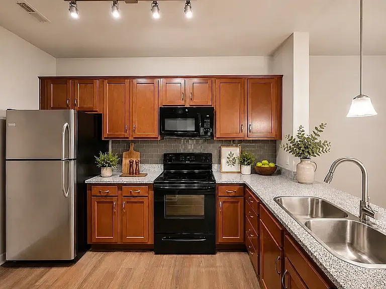 Modern and spacious kitchen with granite countertops and upgraded appliances.