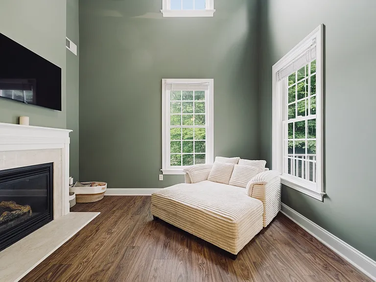 Living room with gas fireplace and new LVP flooring