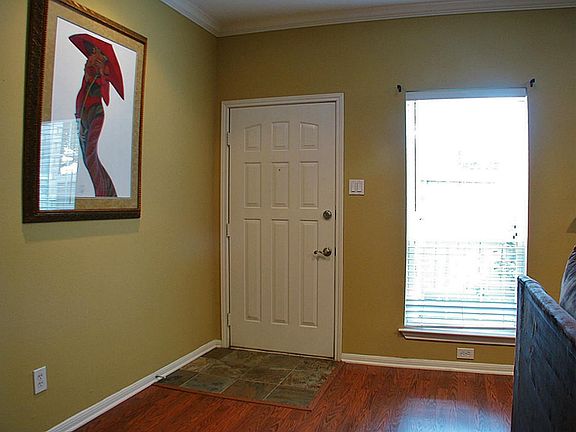 A tiled entry introduces the expansive first floor living ar