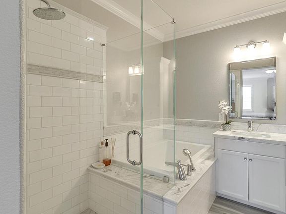 Updated and modern master bath with tub and shower