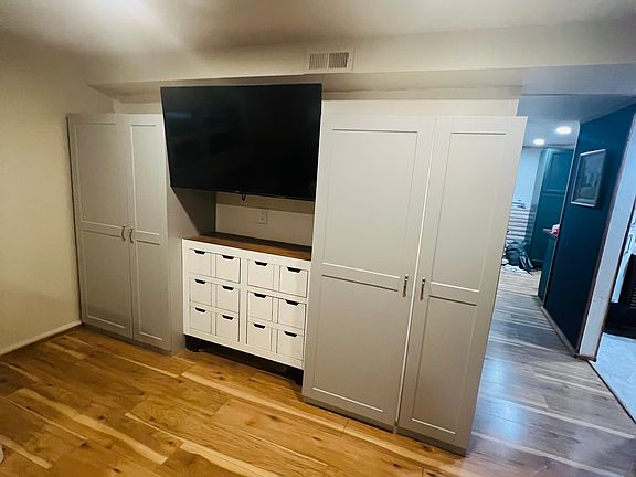 2 closets and dresser and tv