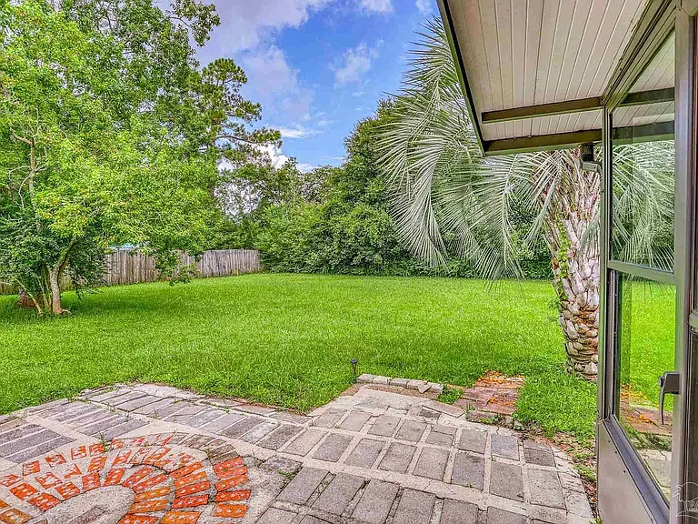 Porch looking out to fenced Backyard