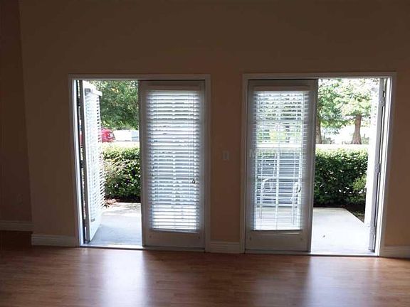 Living room dual french doors to patio with waterview
