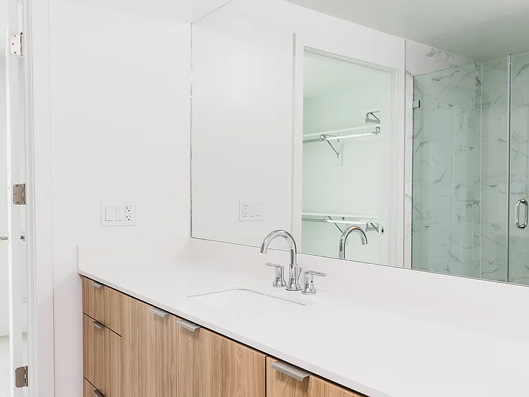 Discover a home with walk-in showers and ample natural light.