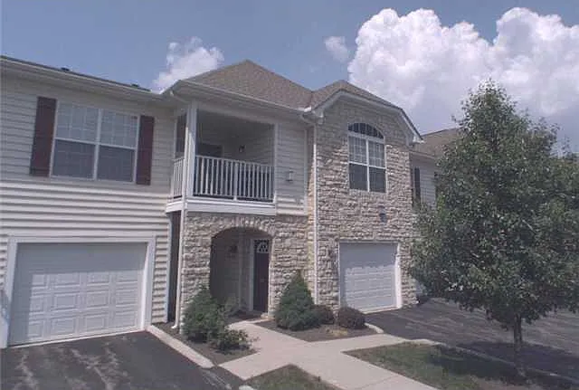 Property Entrance Area with Attached Deep one car Garage