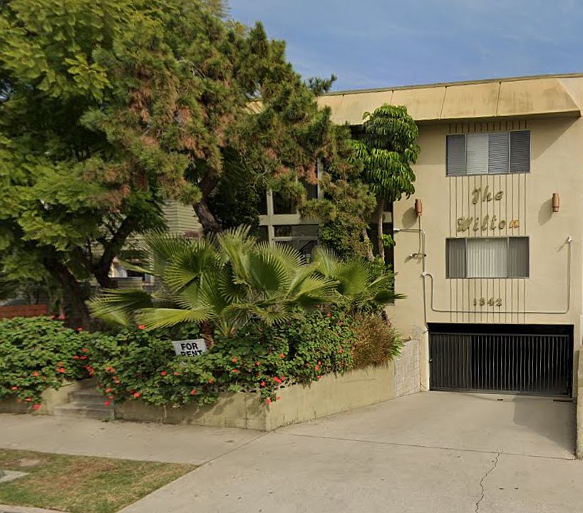 front of building; unit is top right window; gated subterranean parking garage