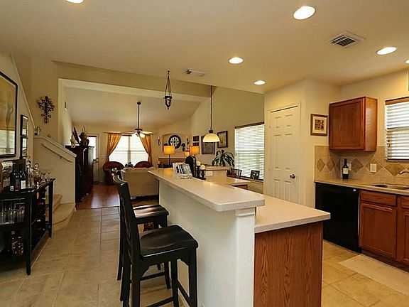 View of the kitchen as you enter and pass the dining room.