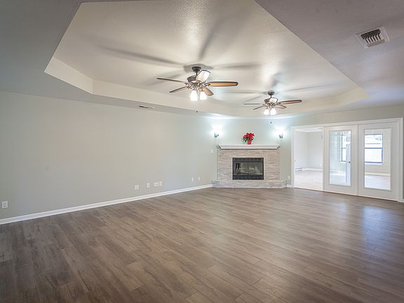 Tray ceiling and fireplace.