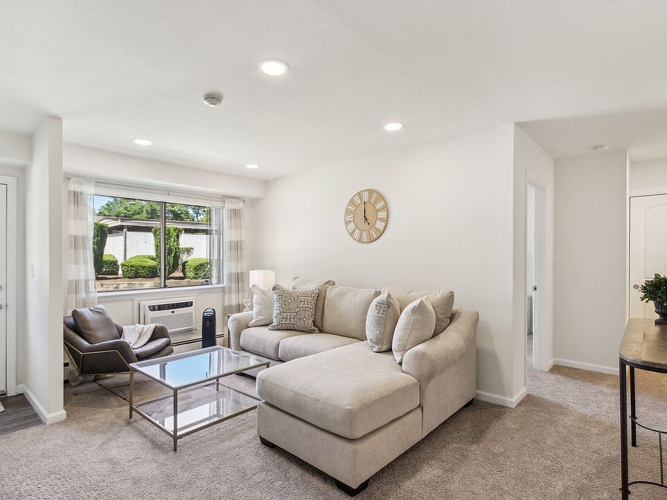 a spacious living room with a couch and a coffee table