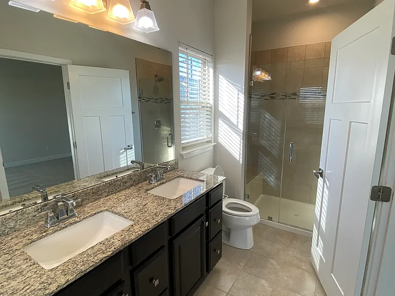 Master bathroom with walk-in frameless shower