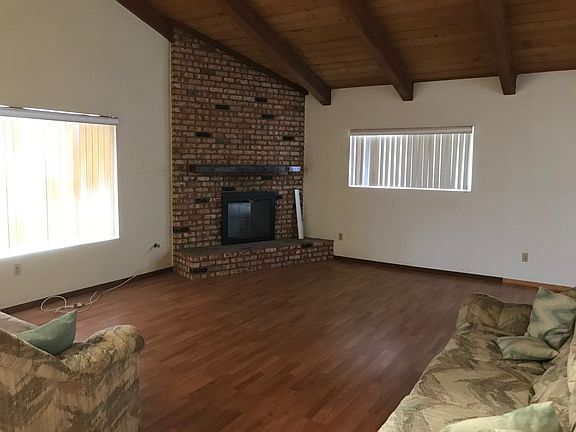 Living room with wood burning fireplace