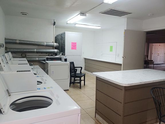 Laundry room on site connected to office.