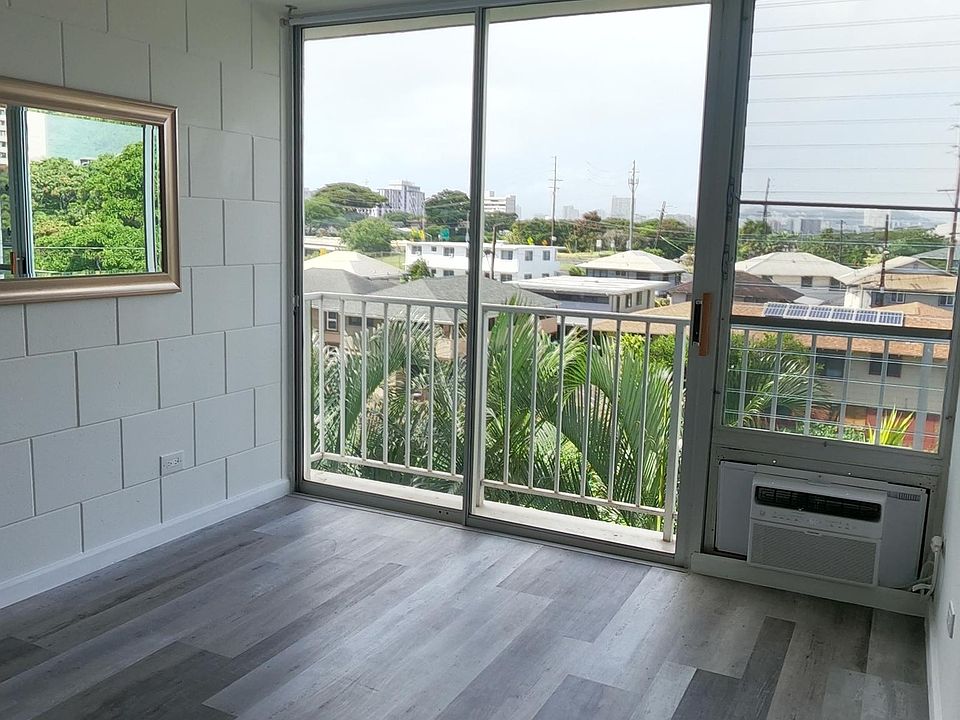 Living room, Air conditioner and ceiling fan both with remote controls.