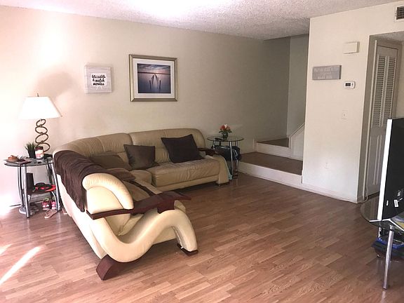 Spacious living room, with vinyl flooring (no carpet in the unit)