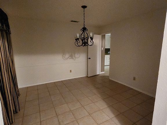 The dining area is versatile, with abiltiy for a large table, comfortable chairs, and stylish decor for any occasion.