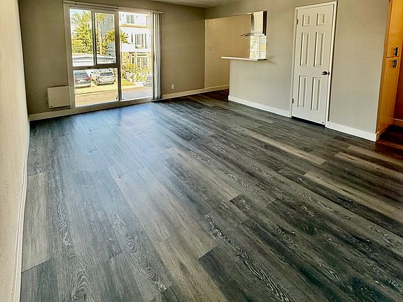 Light and bright oversized living room with a storage/coat closet