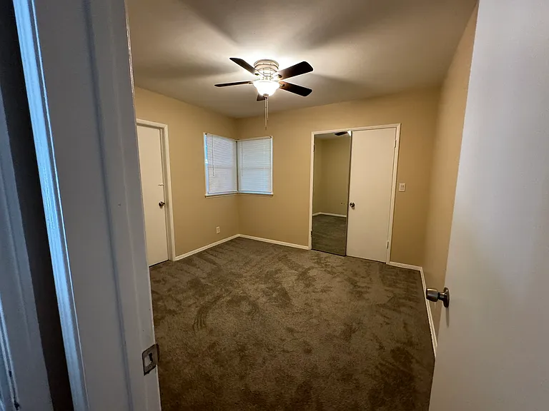 1st Bedroom. New paint, carpet and ceiling fans.