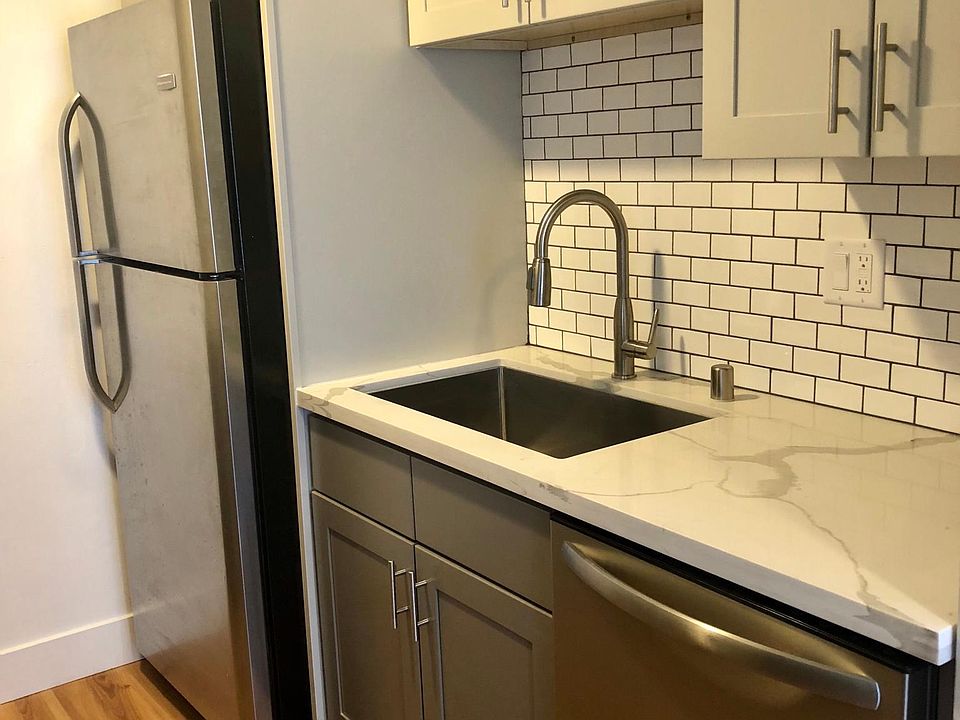 kitchen deep sink with stainless appliances.