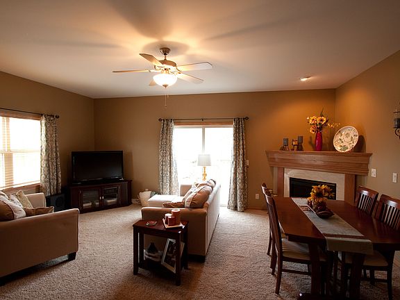 View of the great room from the kitchen. Sliding screen door leads to deck.