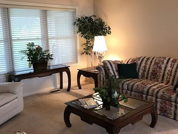 View of living room from kitchen and family room.