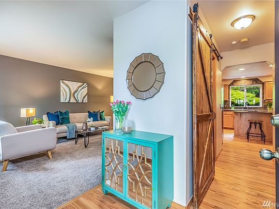 Entry, Living Room on Left, Hall to Powder Room & Kitchen Ahead