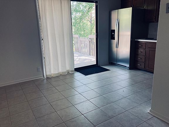 Eat-in kitchen with sliding door onto deck.