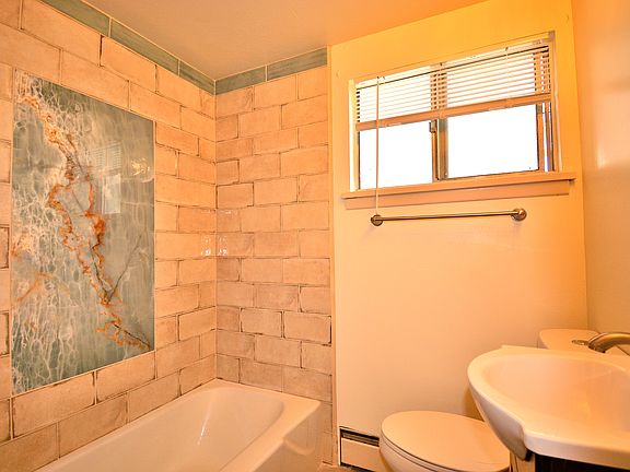 Remodeled throughout. Beautiful bathroom title.