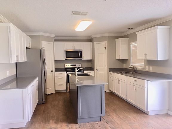Kitchen w all new appliances, sinks, dishwasher, fridge, stove, microwave, dual garbage disposals with air buttons